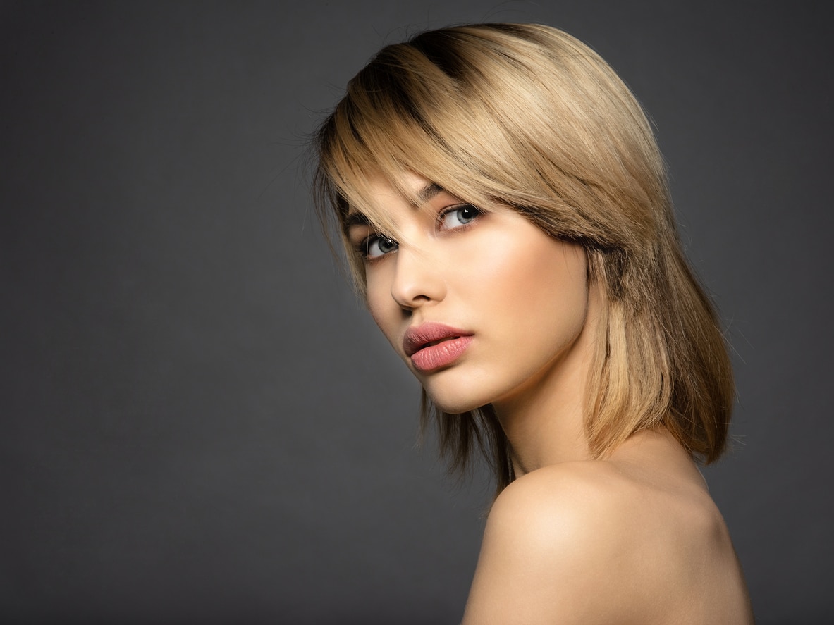 Woman with fringe haircut to add volume to thin hair