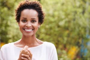 Woman with short curly haircut or a pixie