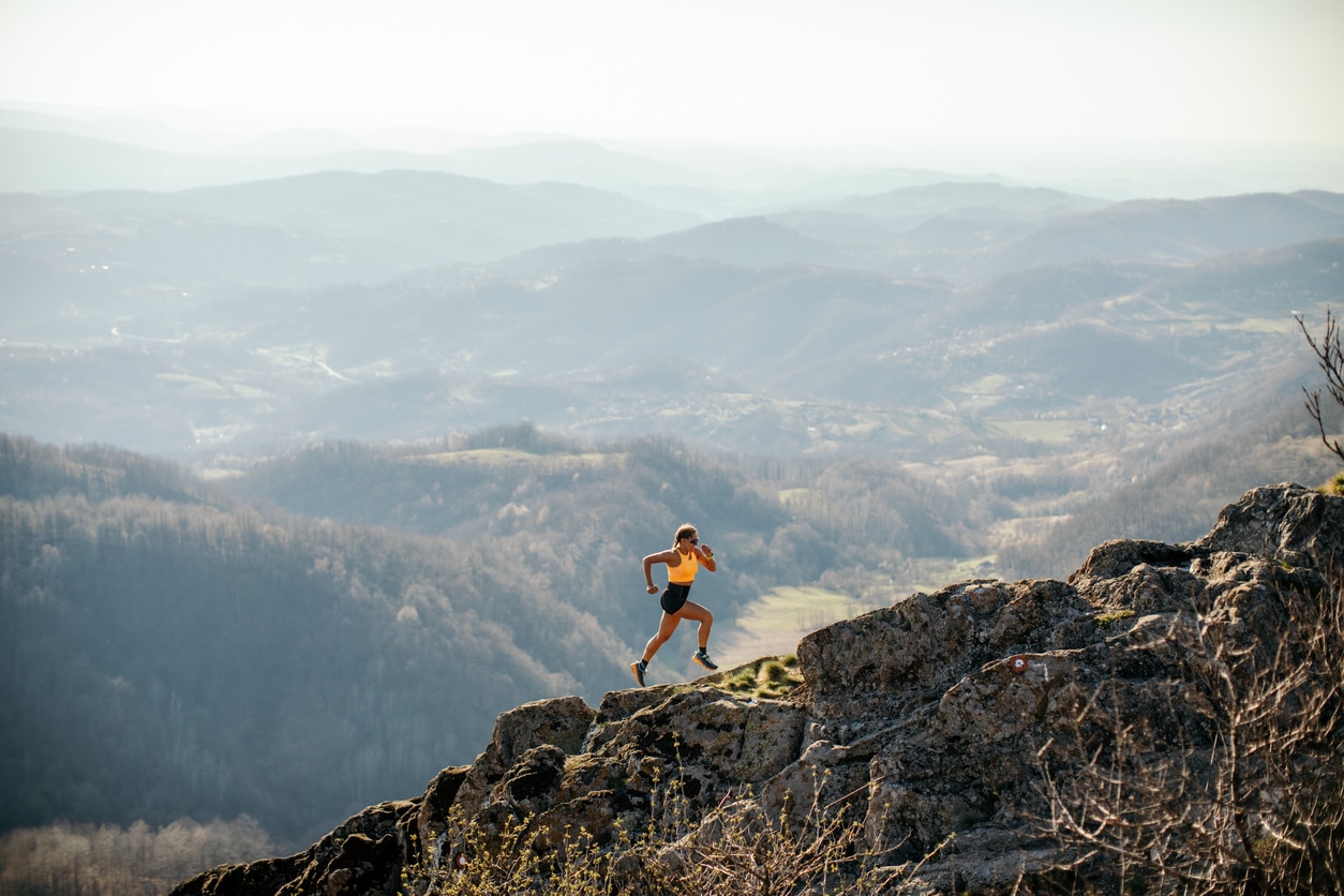 Woman running on a mountain - Do Not Age gives you energy