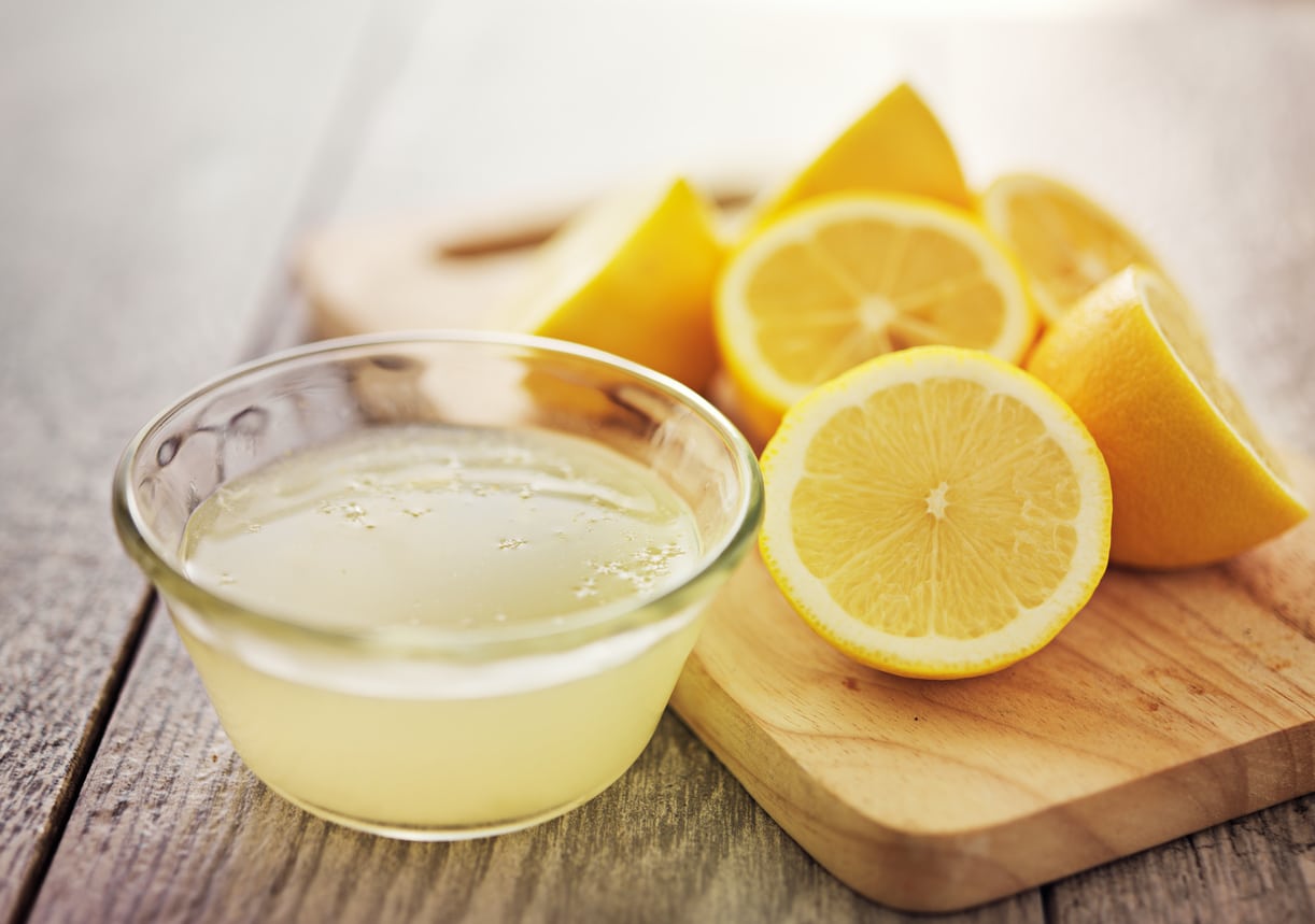 Fresh lemons and lemon juice have health benefits - olive oil and lemon juice