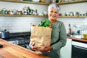 Money-Saving tips for grocery shopping woman with shopping bag