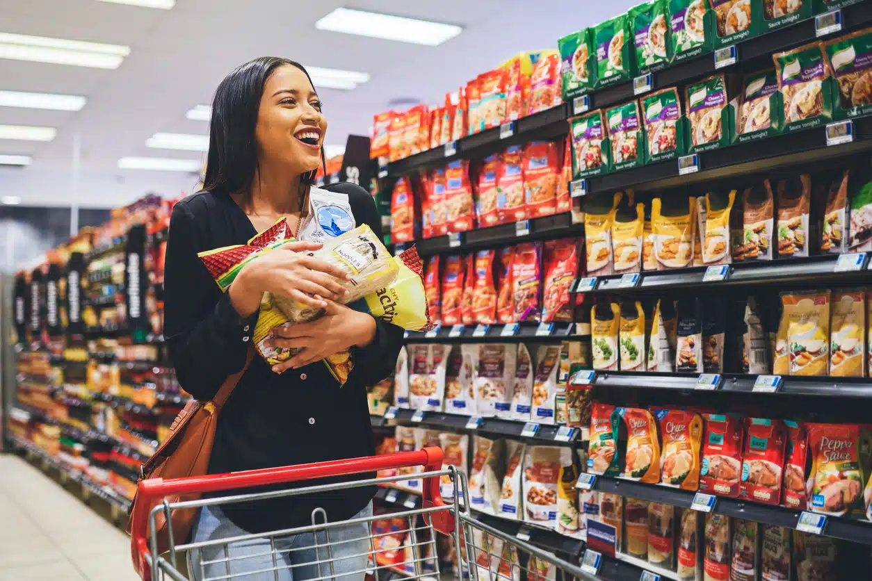 Woman buying junk food shopping hungry - money-saving tips