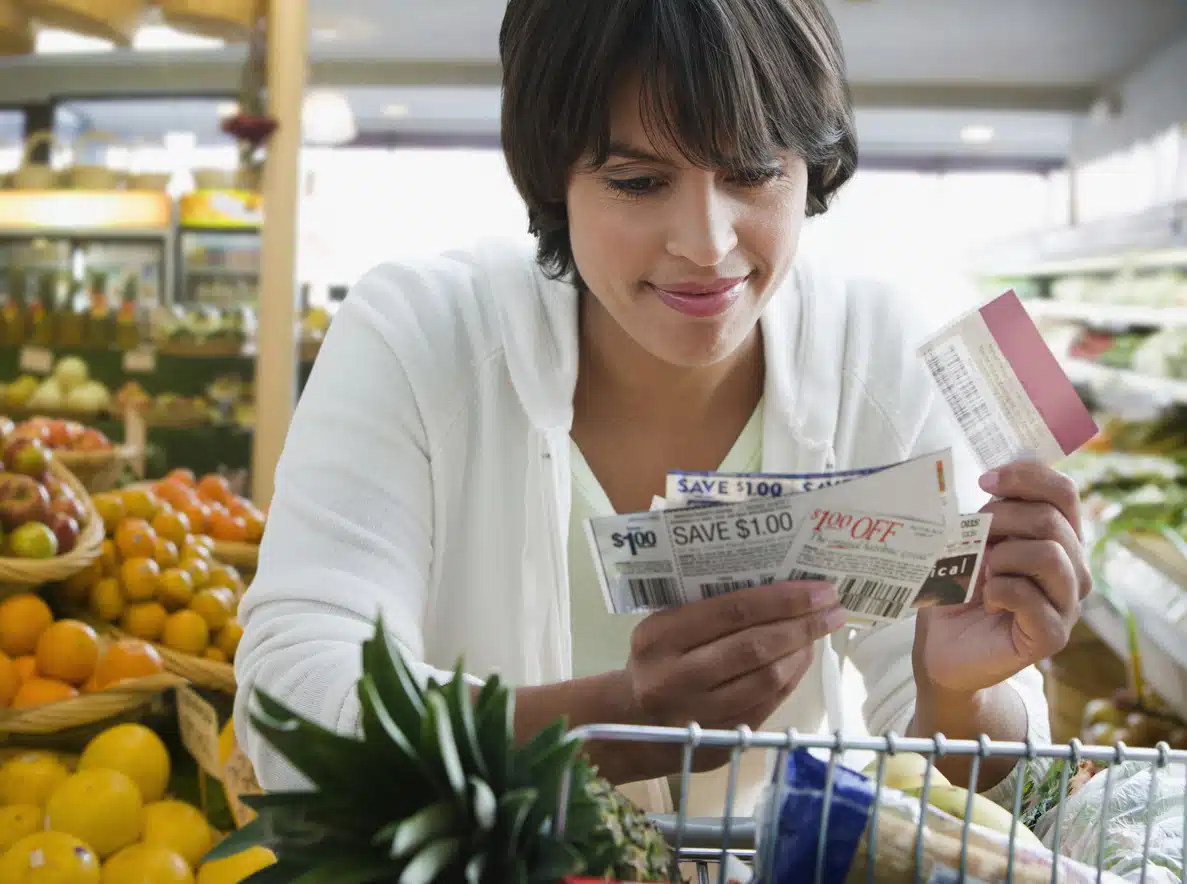 Woman shopping with coupons