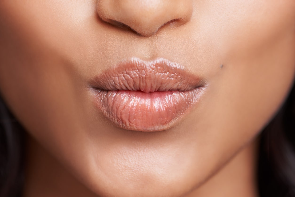 Swan neck stretch with puckered or pursed lips