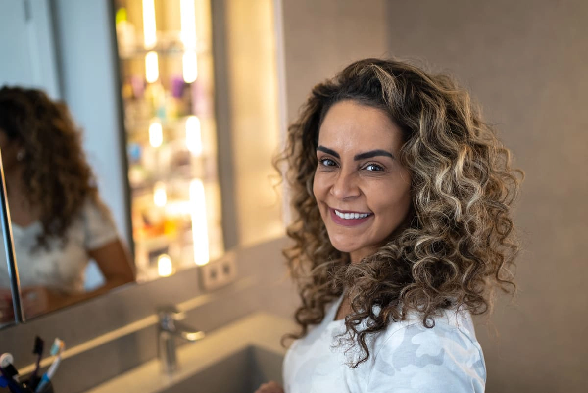 Jumbo curly rollers feature older woman