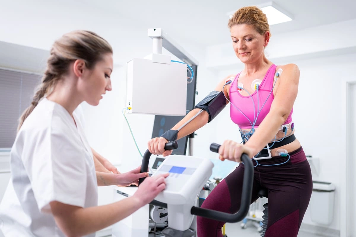 Woman getting stress test on a bike