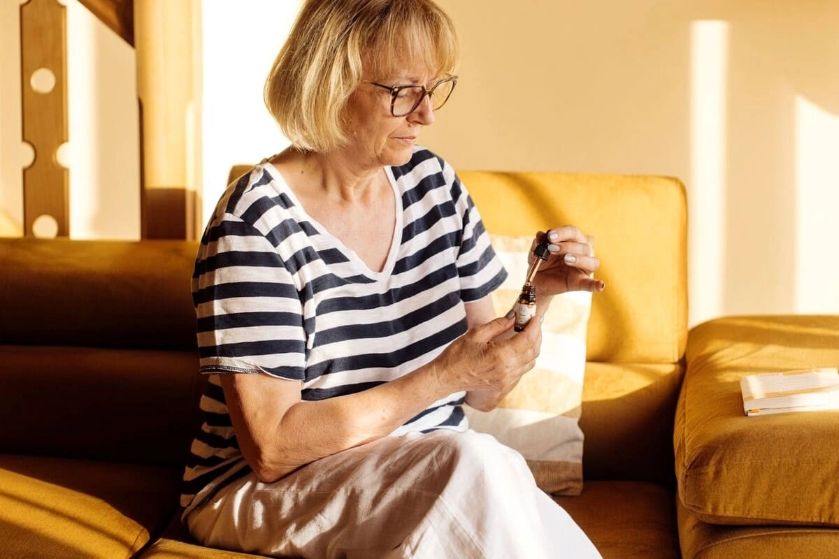 Woman using Evopure CBD Oil