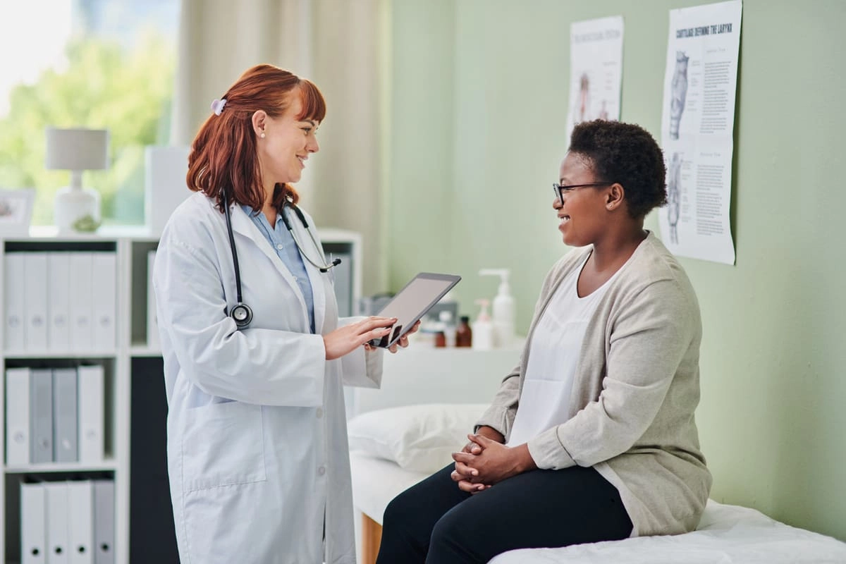 woman talking to doctor