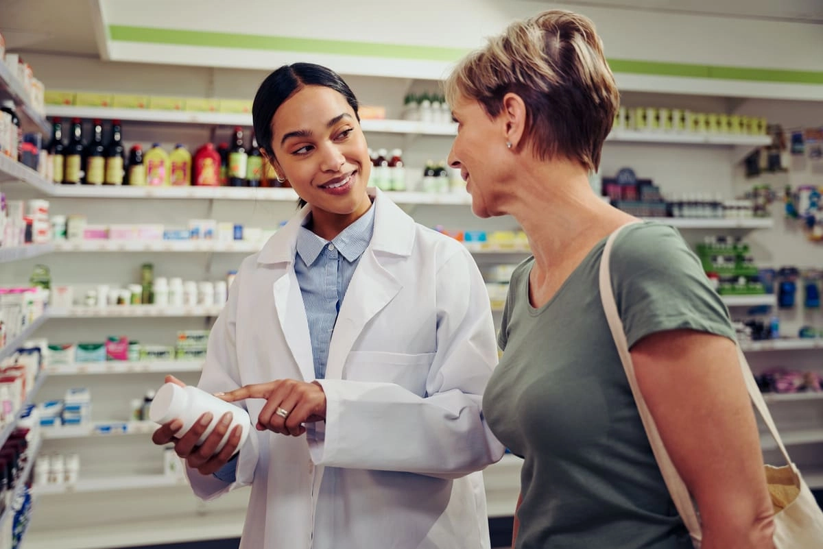 woman talking to pharmacist