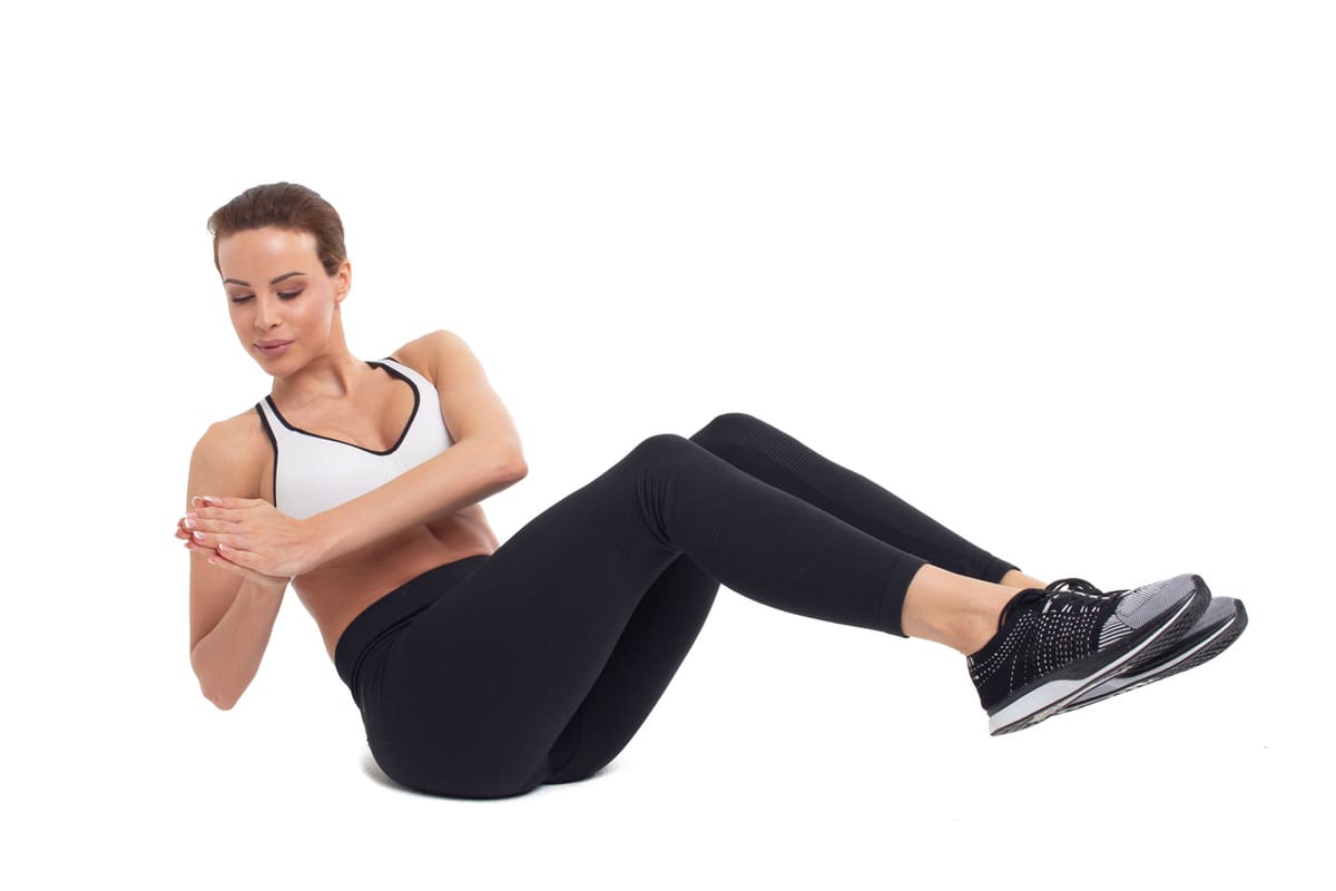 Woman in Russian twist oblique workouts