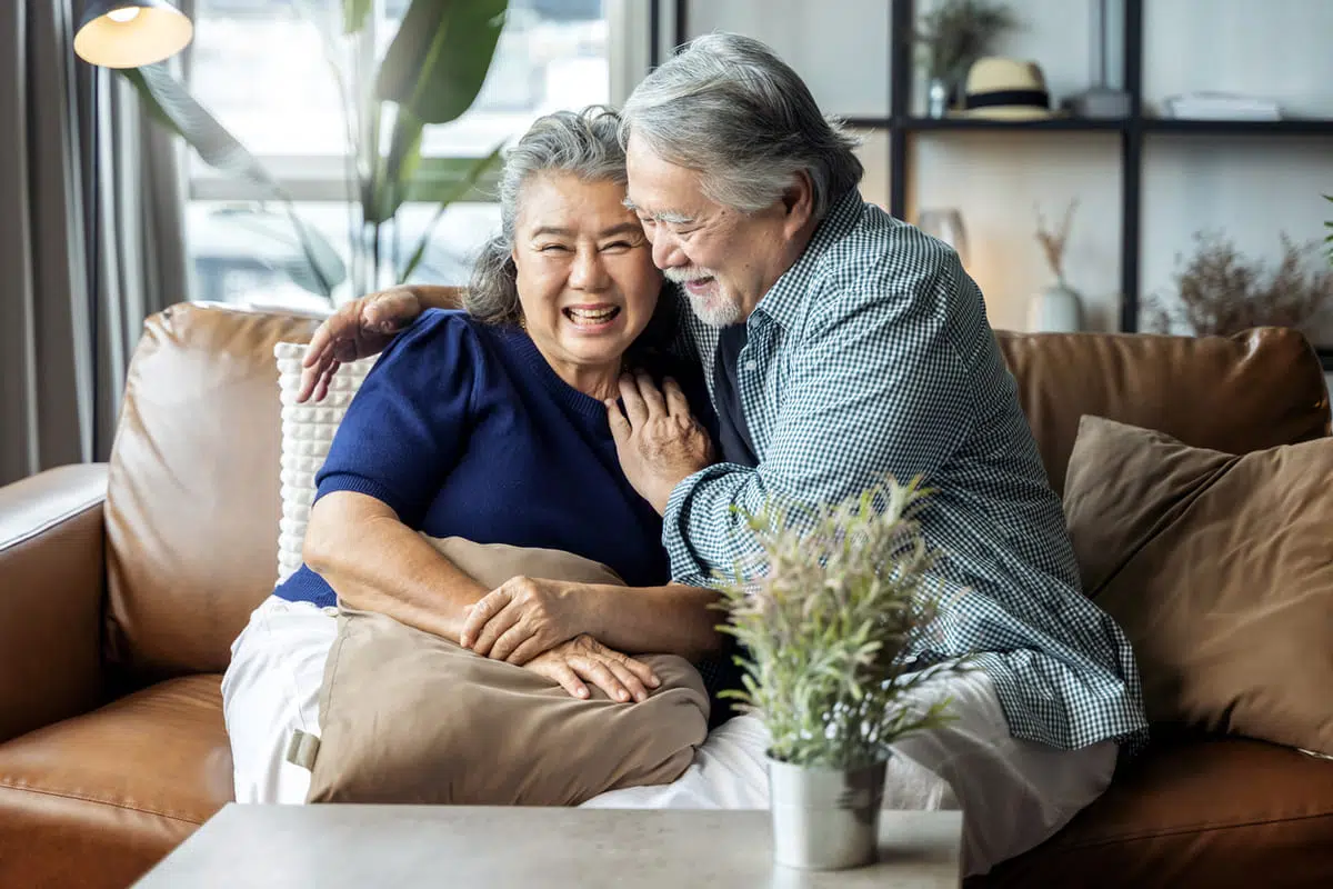 Couple hugging on a couch
