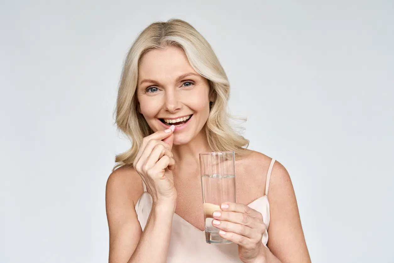 Lady taking supplements