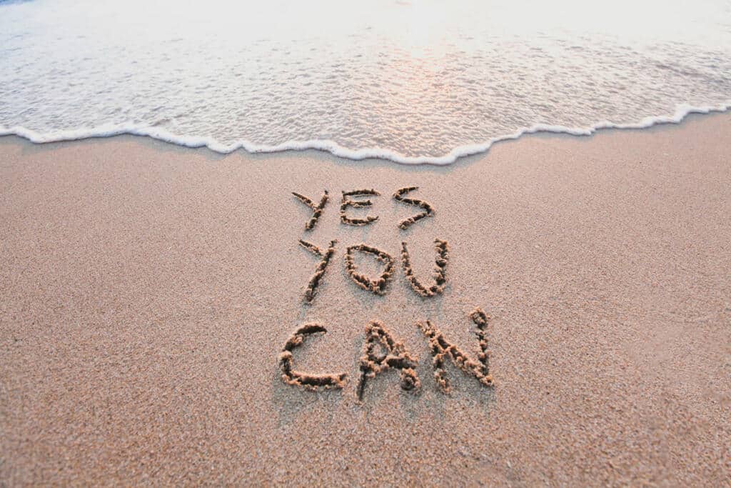 sources of strength feature: "yes you can" written in the sand