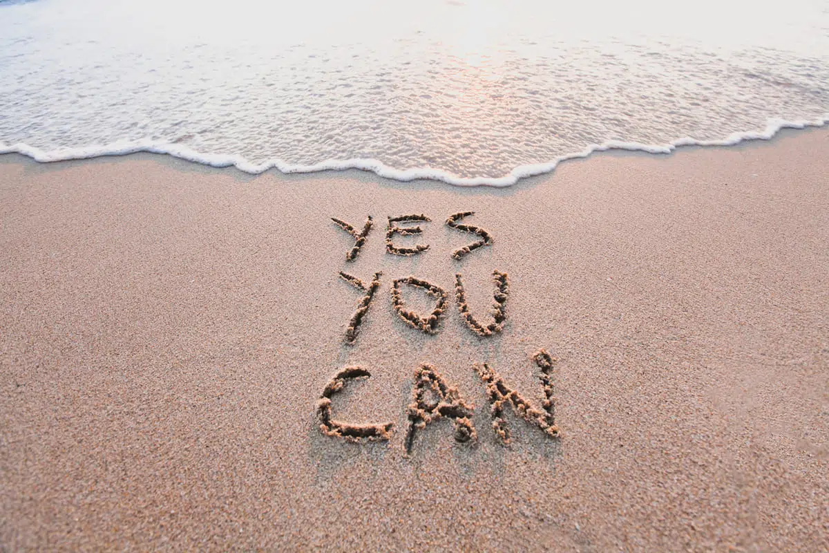 sources of strength feature: "yes you can" written in the sand