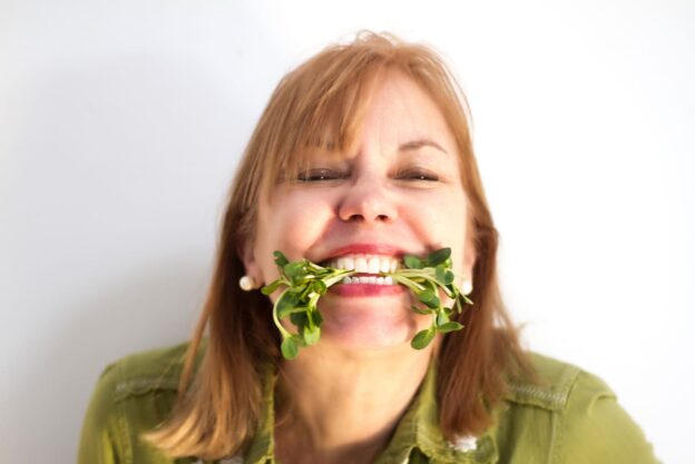 woman with broccoli sprouts