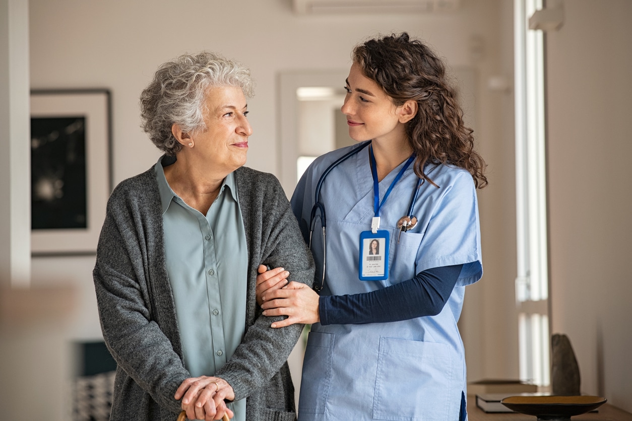 Caregiver or nurse with older woman