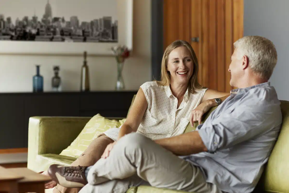 Couple chatting on the couch; conversation