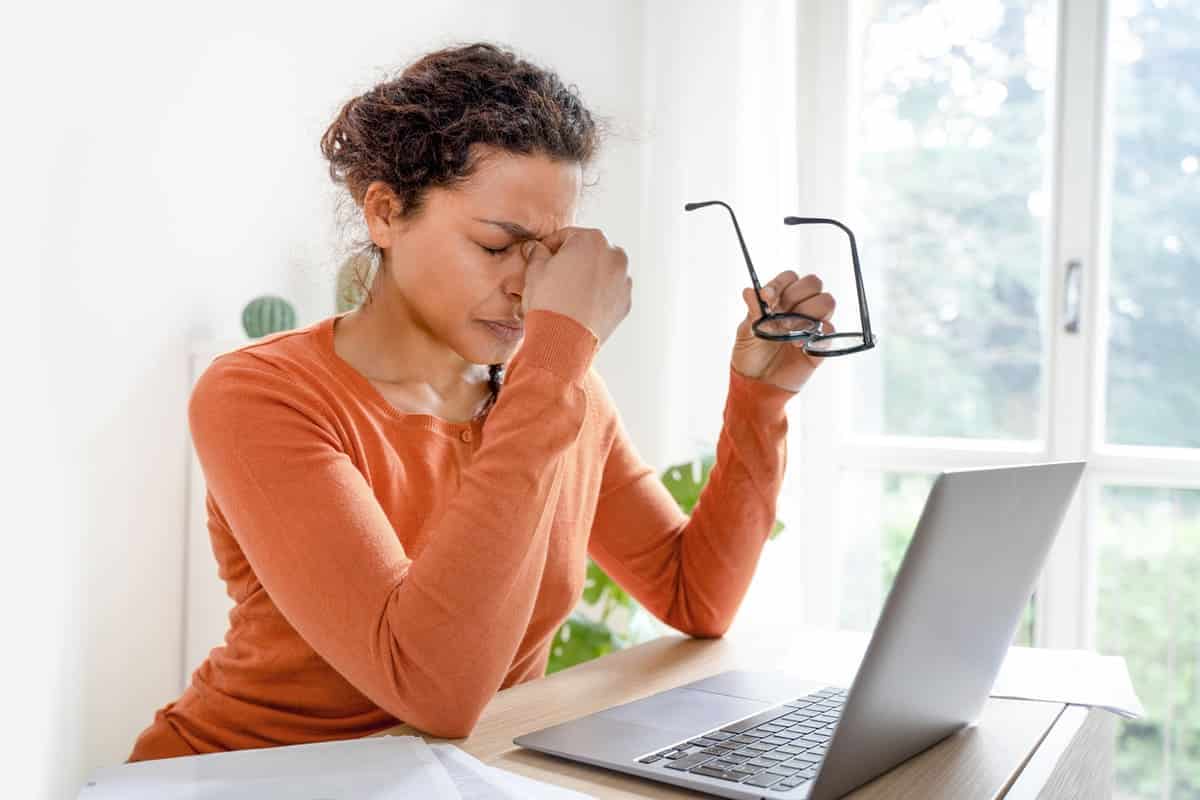 Stressed woman at her desk