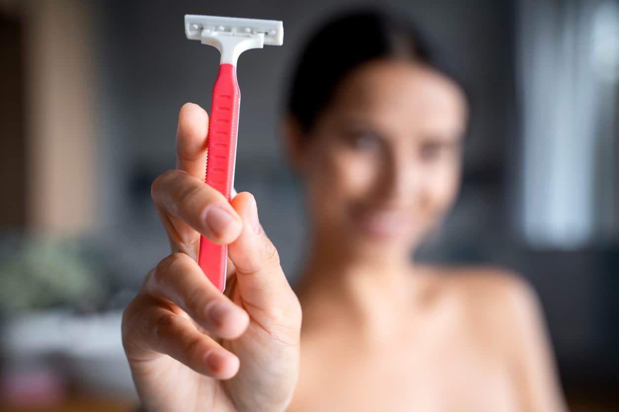 Woman holding a razor