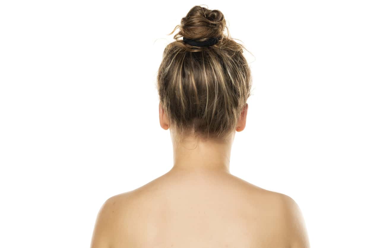 Messy bun top knot hairstyle