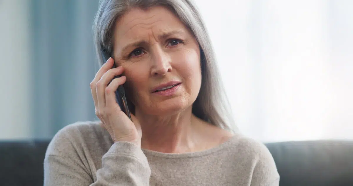 Woman on the phone looking upset