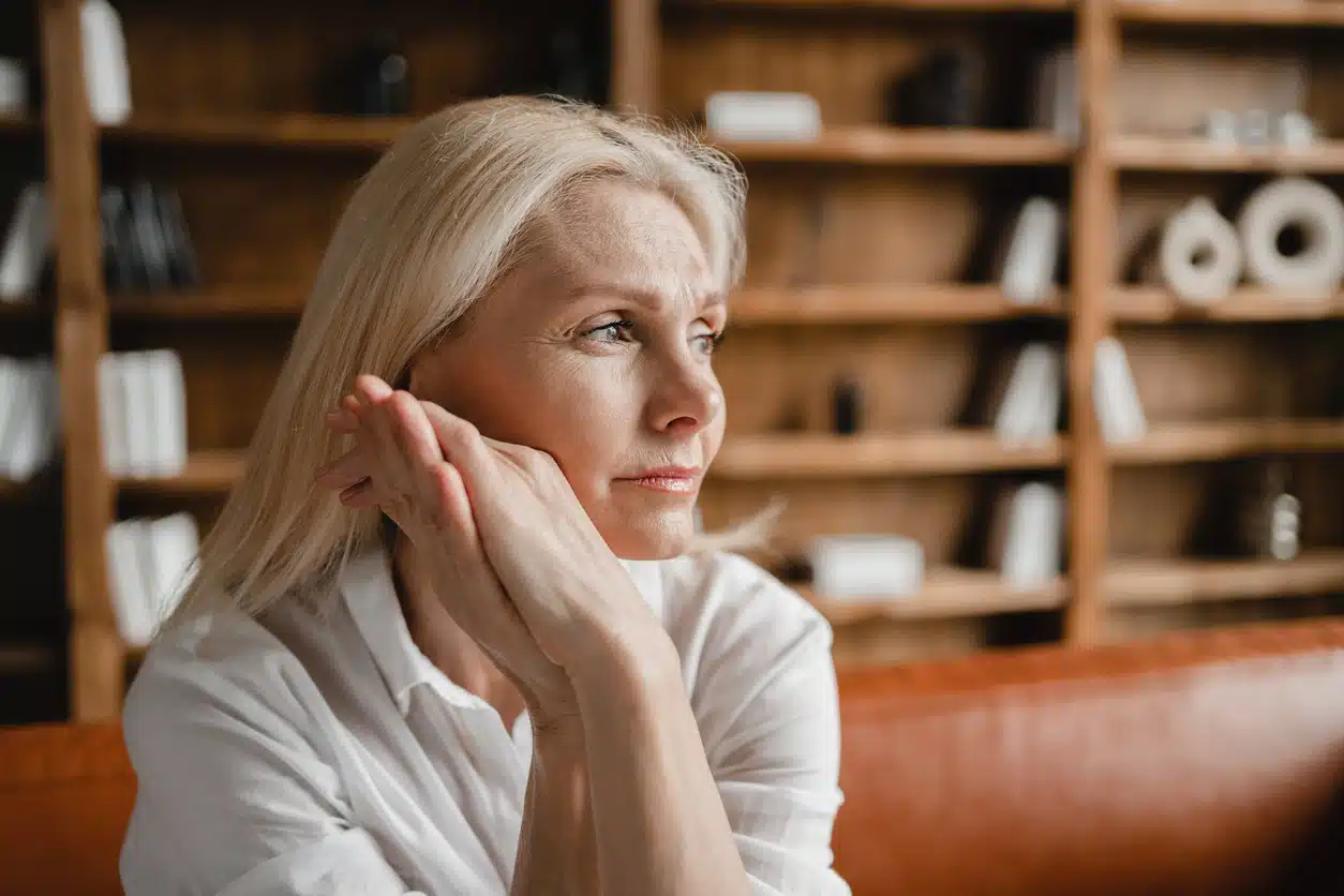Sad woman looking out the window