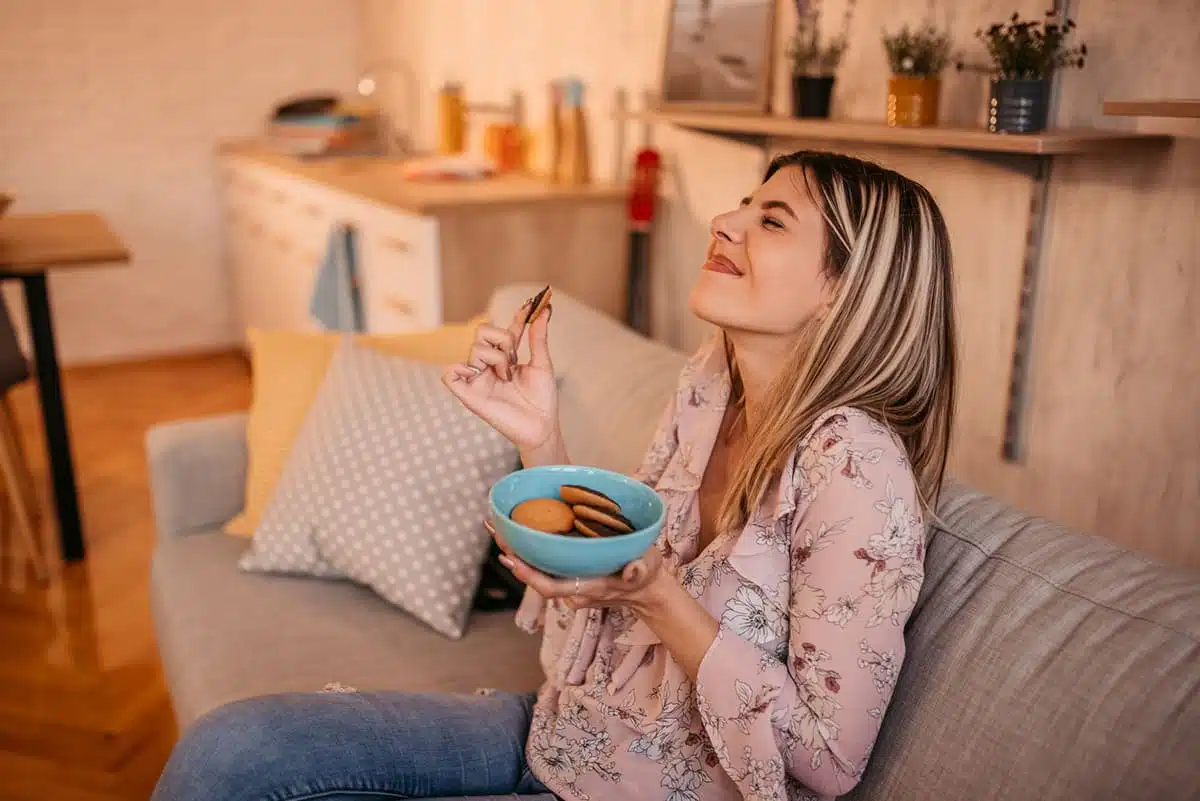 Woman eating cookies