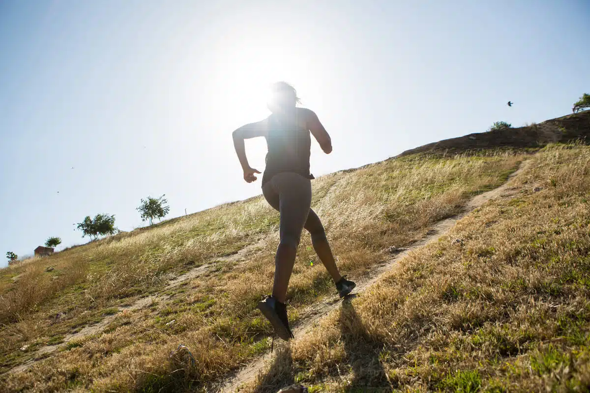 Woman running up a hill