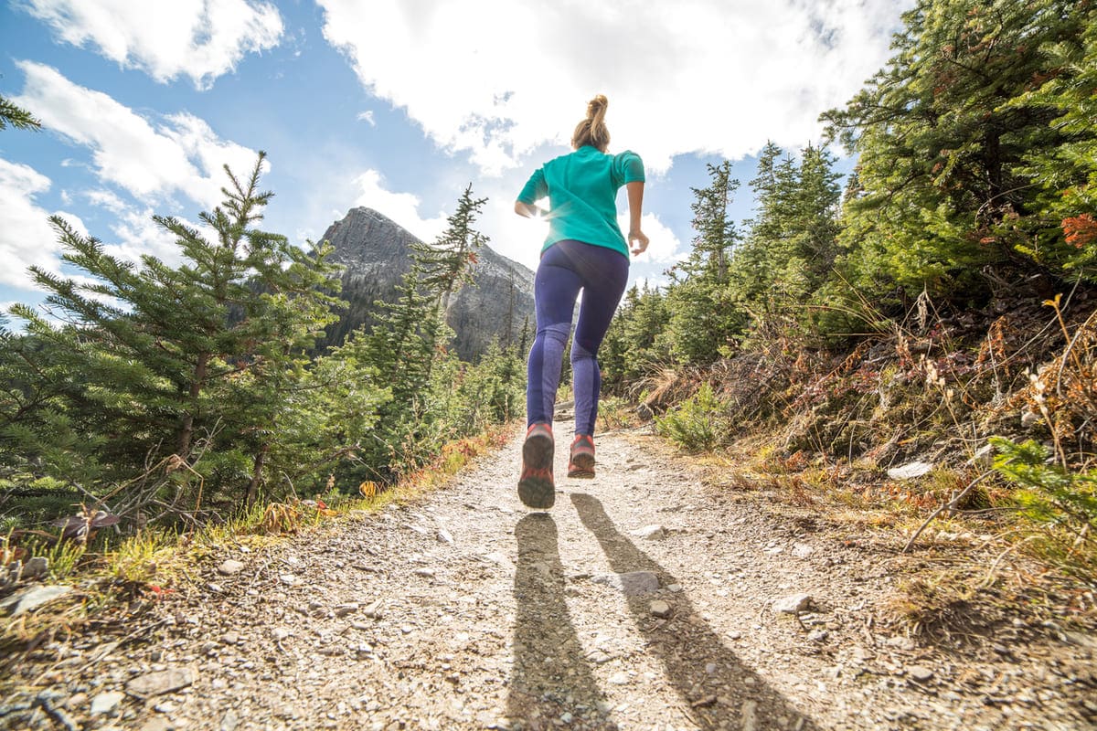 Woman running up hill