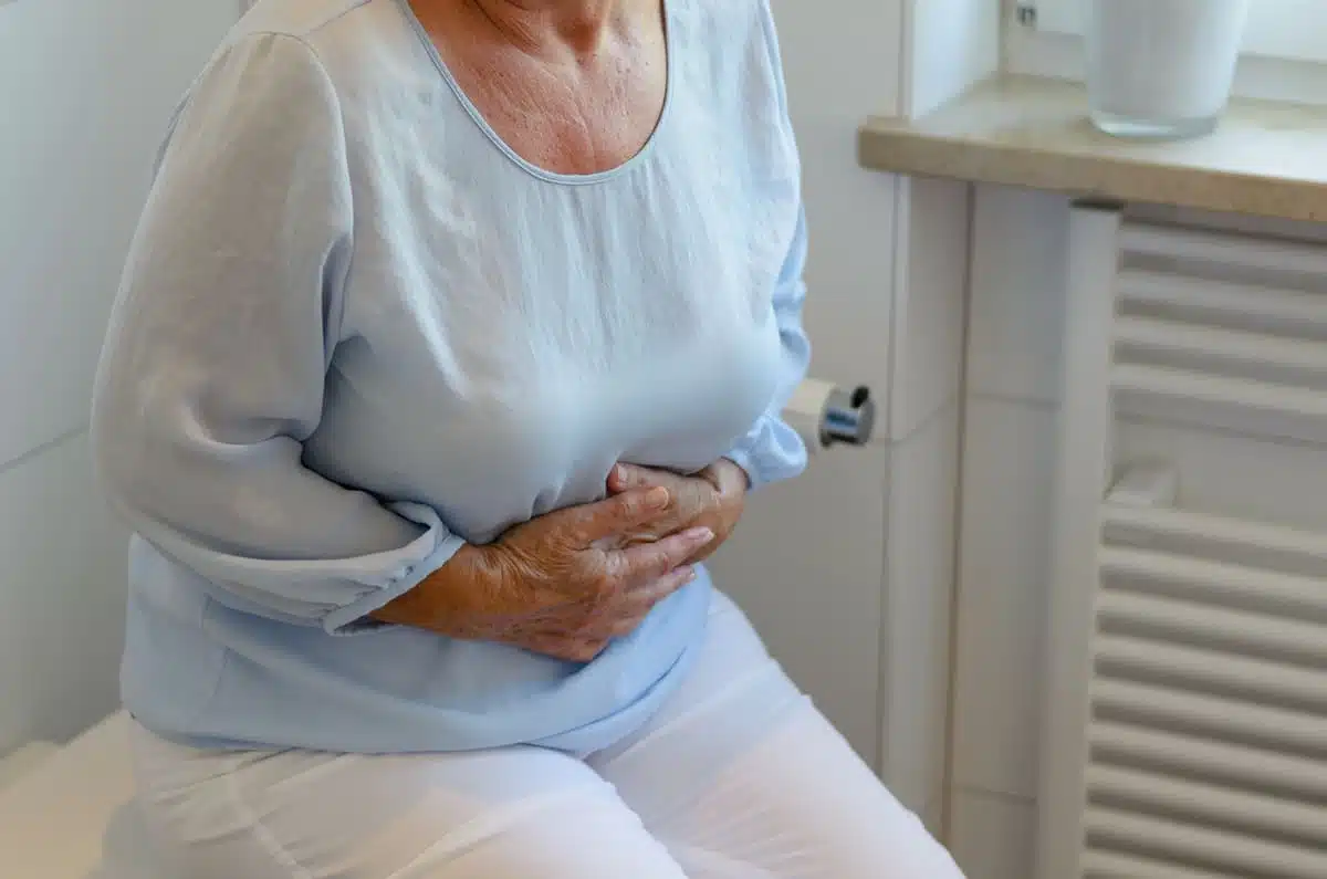 Woman sitting on the toilet constipated