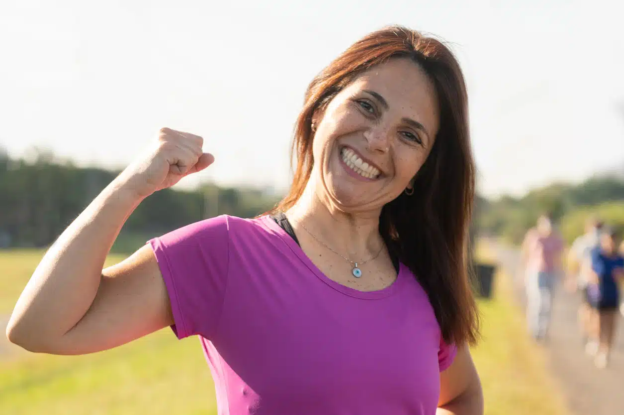 Happy woman on a hike end of a workout