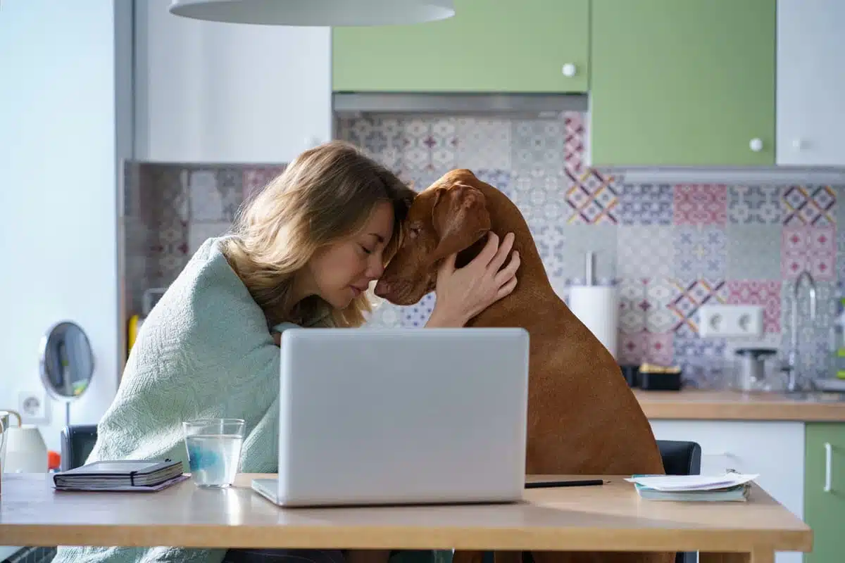 sad woman with her dog