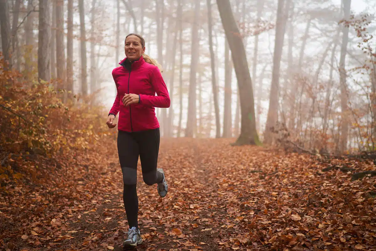woman running in the woods