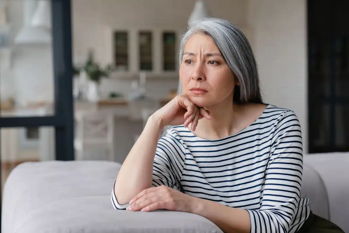 Sad woman on the couch