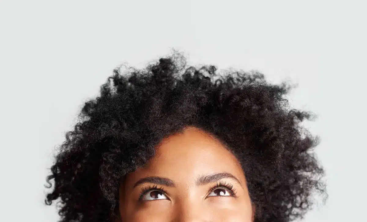 Woman thinking and looking up