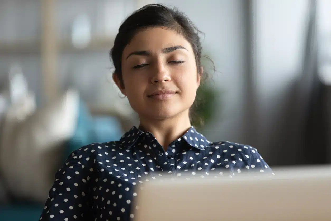 At peace, meditation at looking at computer