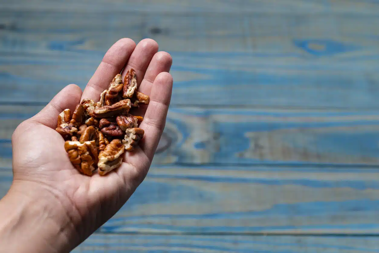 Woman eating pecans
