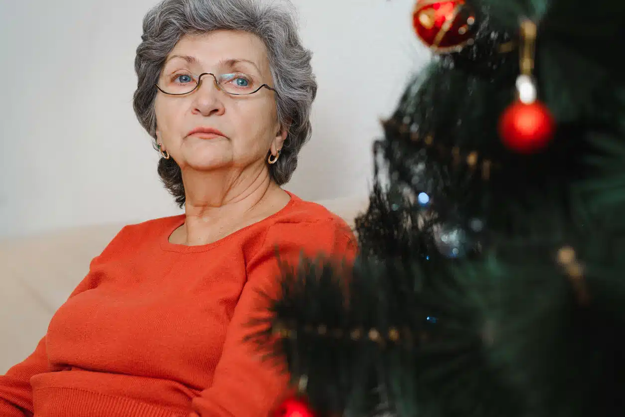Sad woman at Christmas time; how to help a friend who is grieving