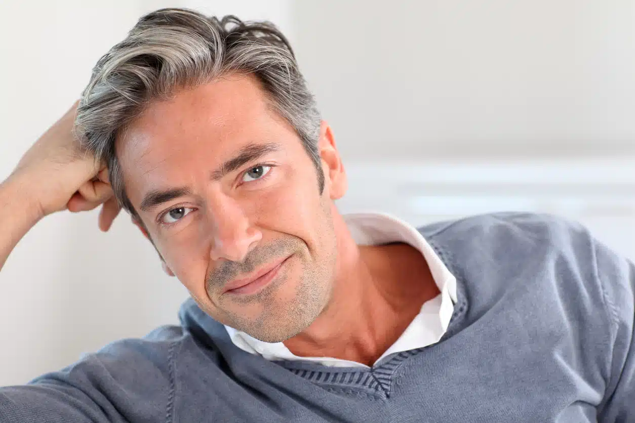Handsome man relaxing in sofa at home