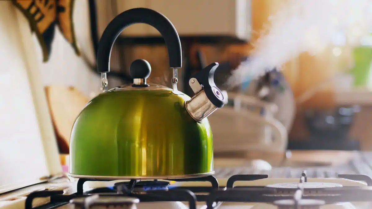 kettle on the stove boiling water