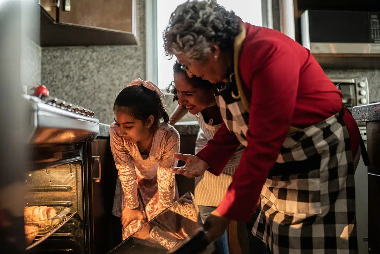 Grandma baking cookies with grandchildren