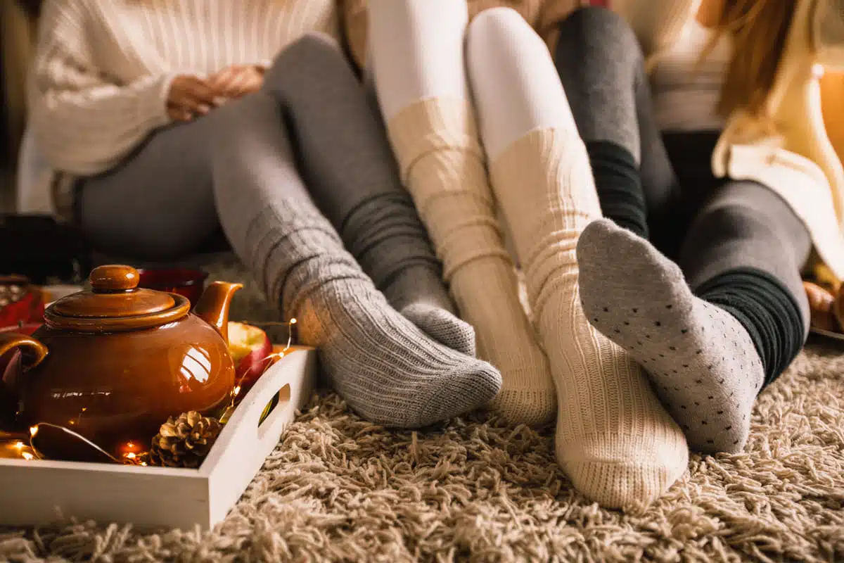 sitting together relaxing to bring hygge to your holidays
