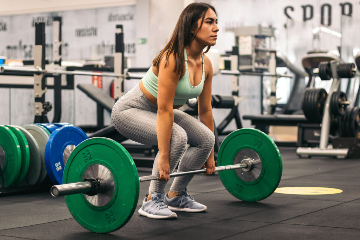 woman doing a deadlift  at the gym