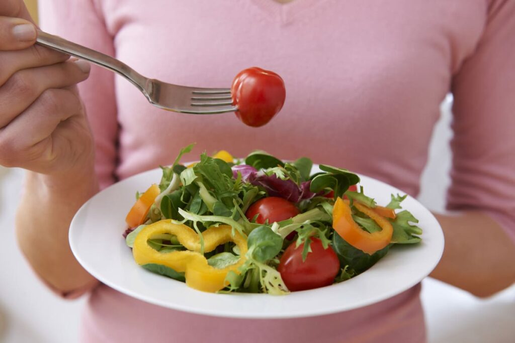 woman eating a salad