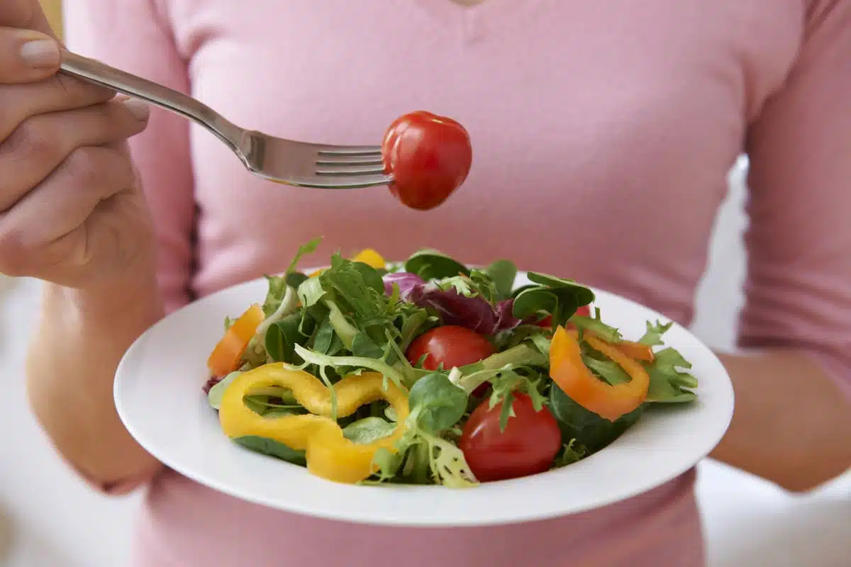 woman eating a salad