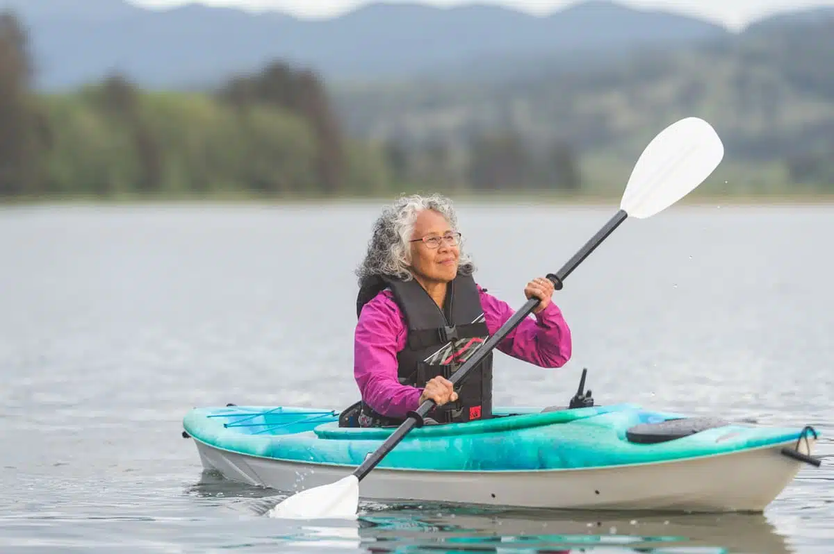 woman kayaking; exercise; working out