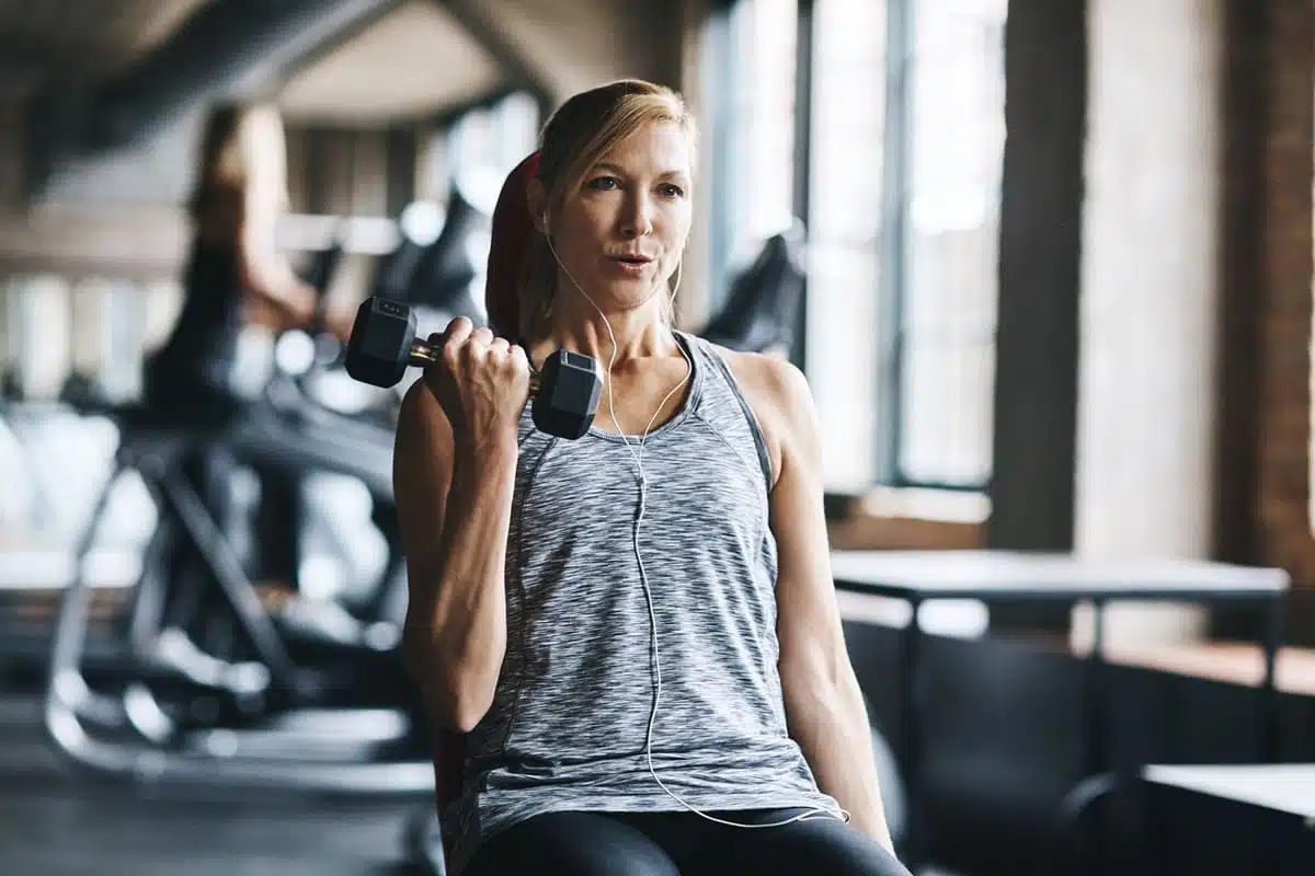 woman lifting weights bicep workout