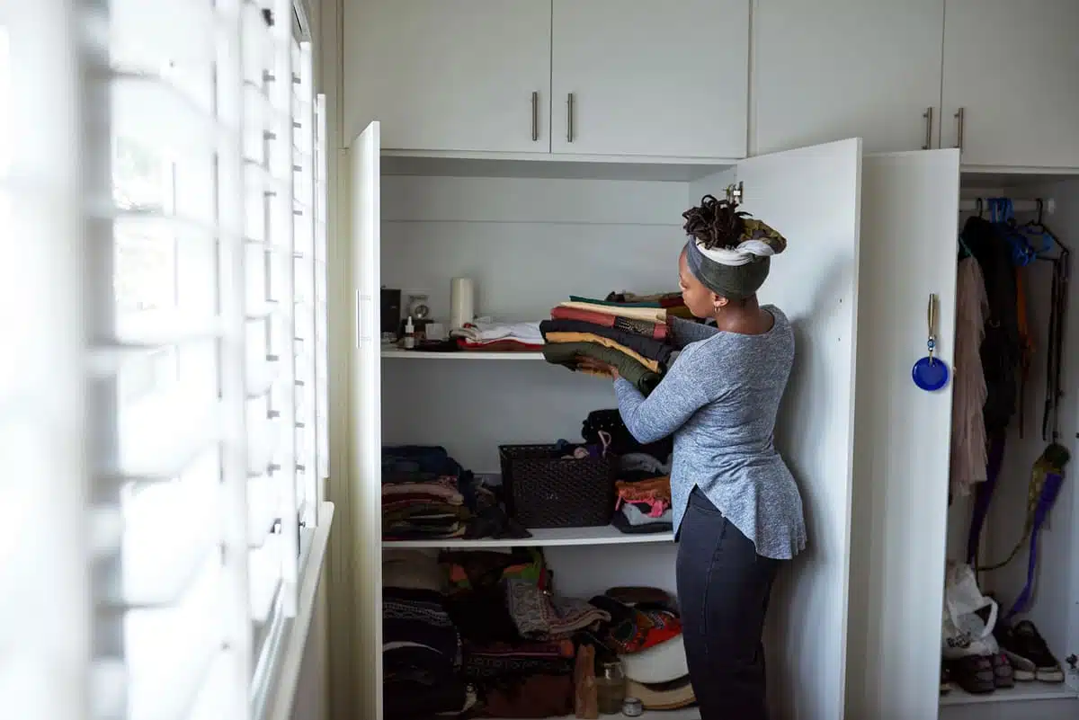 woman putting things away