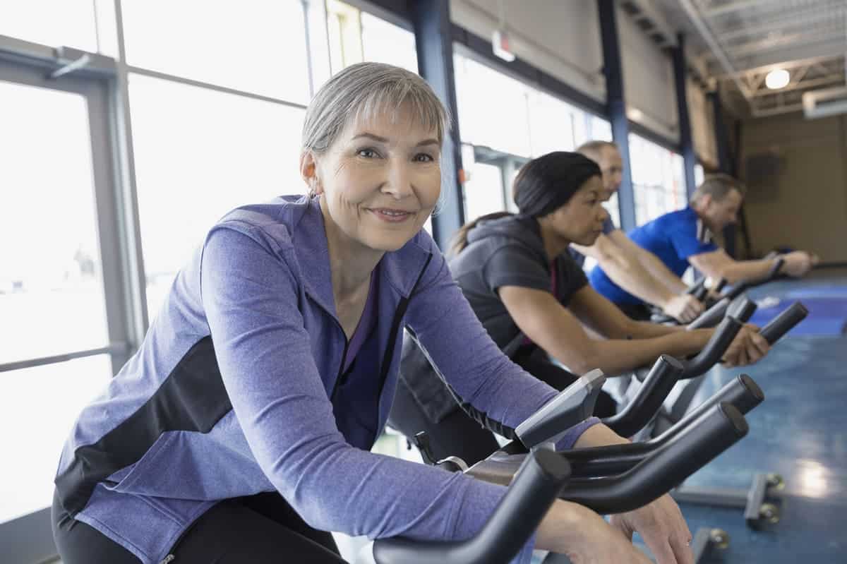 woman riding on an exercise bike