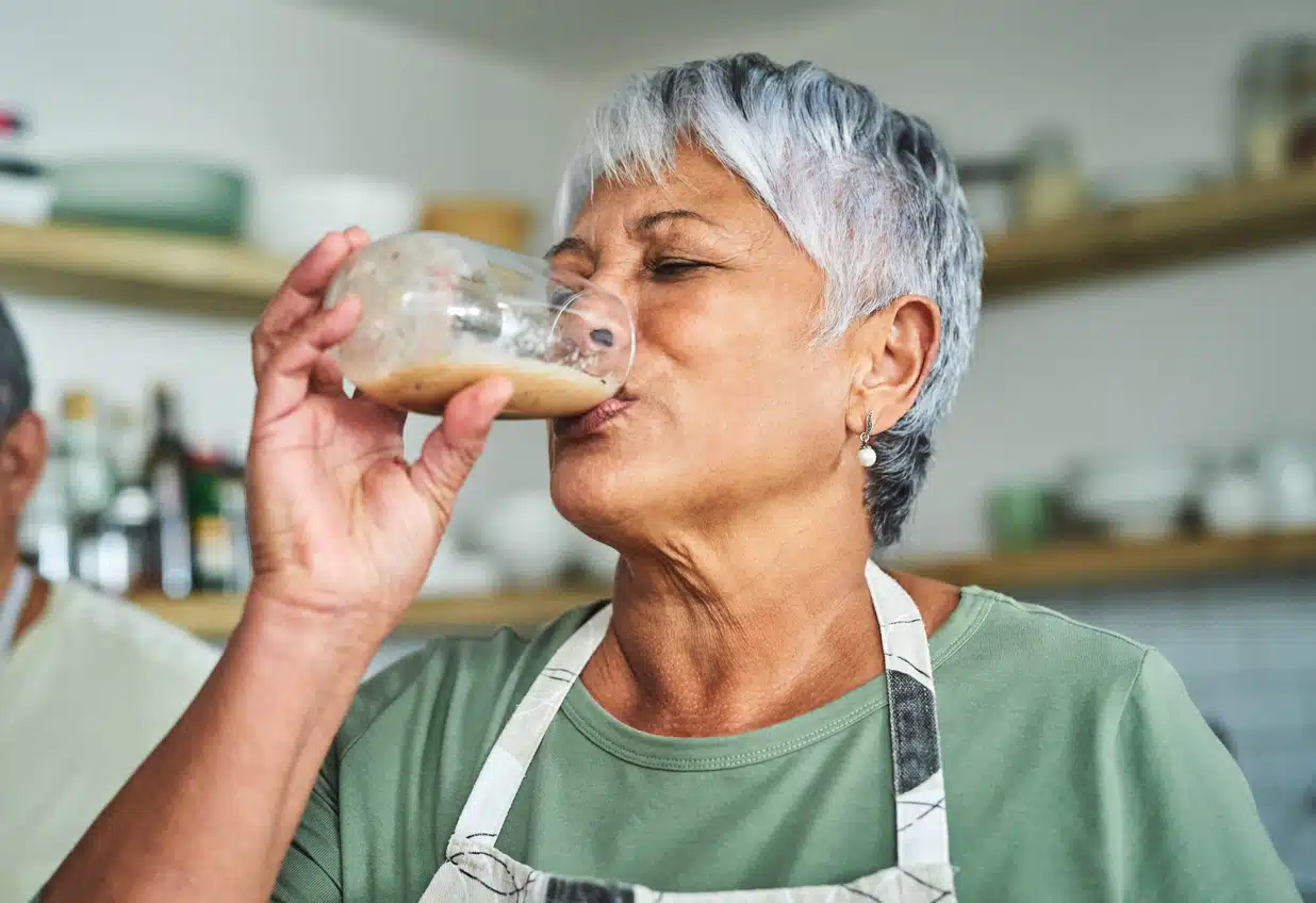 Woman drinking a smoothie; Ka'Chava